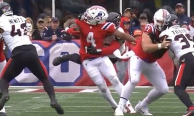 New England Patriots running back Antonio Gibson gets brought down by his facemask against the Houston Texans. No penalty was called.